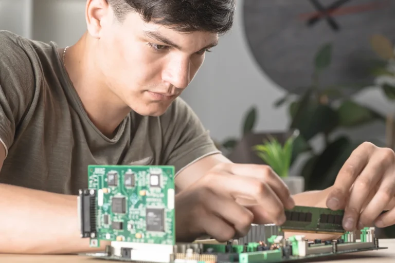 it-technician-students-inserting-ram-computer-motherboard